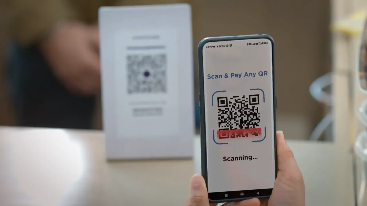 Indian Rupee banknotes and coins next to a smartphone displaying a digital payment app interface, symbolizing the Digita (3)